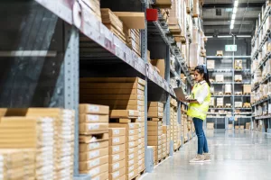 A warehouse manager exploring Artintech's Warehouse Management System Features in Canada | WMS